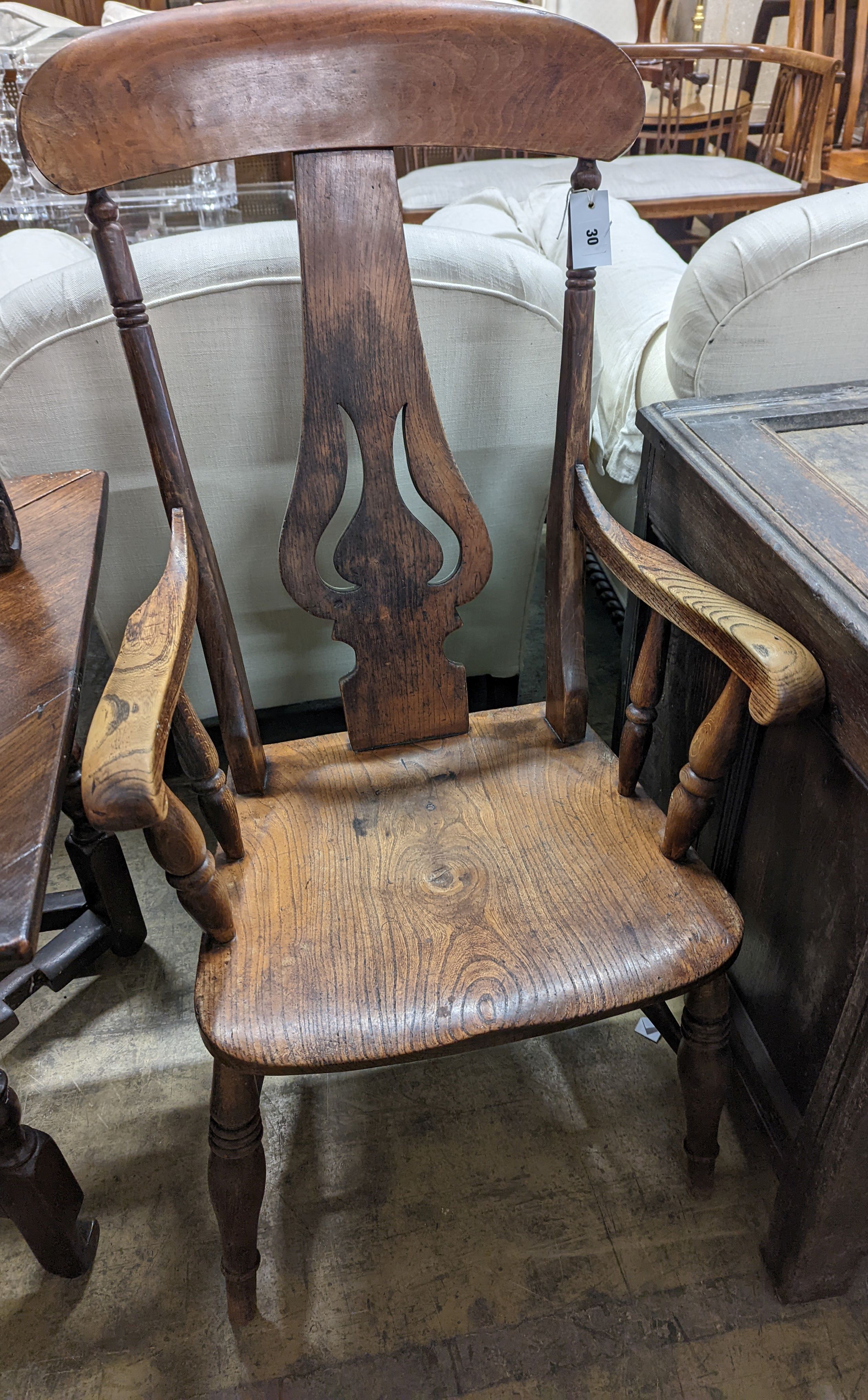 A Victorian elm and beech Windsor armchair with pierced splat stamped J D 33, width 56cm, depth 43cm, height 112cm